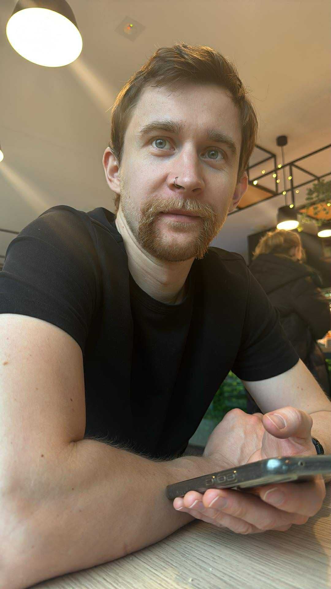 Portrait of Maciej Warych, full-stack developer and founder of Aiwryt